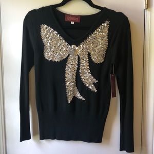 Bestow black sweater sequin bow. New with tags